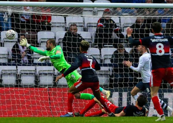 Preston North End's Michael Crowe can't prevent Tom Anderson making it 2-1