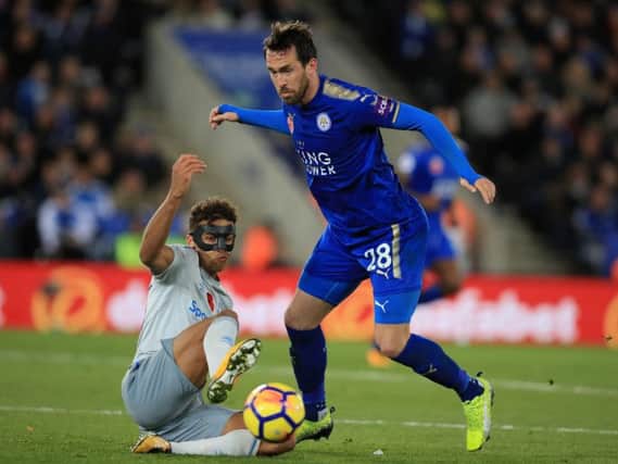 Everton's Dominic Calvert-Lewin and Leicester City's Christian Fuchs battle for the ball during the Premier League match at the King Power Stadium