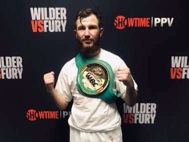 Isaac Lowe celebrates winning the WBC International featherweight title in Los Angeles in December