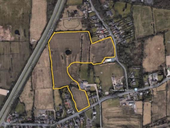 An outline of the land up for sale. Aerial image courtesy of Google.
