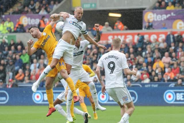 Andrew Hughes in the thick of the action during the defeat at Swansea earlier in the season