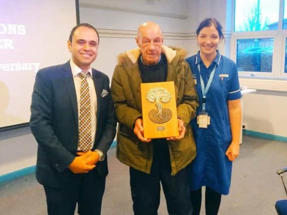 Harry Turner, who has had his new kidney for 50 years, presented with a plaque by Dr Aimun Ahmed, renal consultant, at Royal Preston Hospital and Jenny Barlow, transplant nurse practitioner at Lancashire Teaching Hospitals