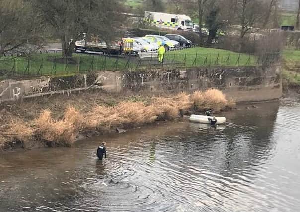 Police search for keys to a stolen Range Rover in the River Ribble off London Road, Preston.