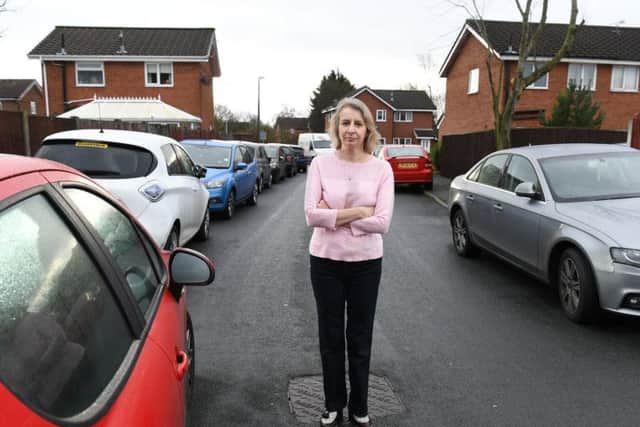 Ana Maria Pinion in St Clares Avenue, Fulwood, surrounded by parked cars