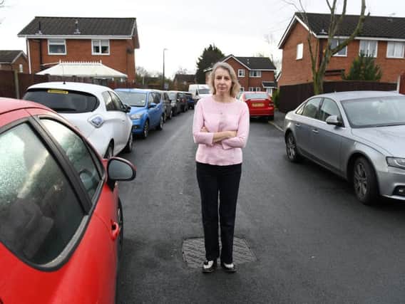 Ana Maria Pinion in St Clares Avenue, Fulwood, surrounded by parked cars