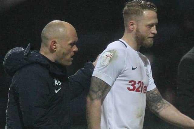 Preston skipper Tom Clarke had to come off with a calf injury against Swansea (above)