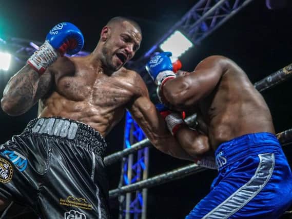 Damian Chambers on his way to victory over Elvis Dube. Picture: Chris Roberts for MTK Global