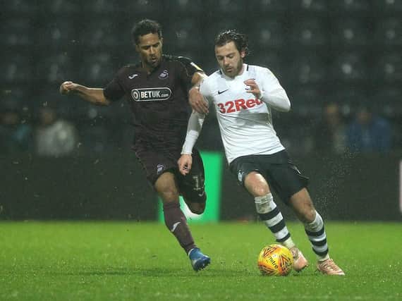Ben Pearson battles with Wayne Routledge during PNE's 1-1 draw with Swansea