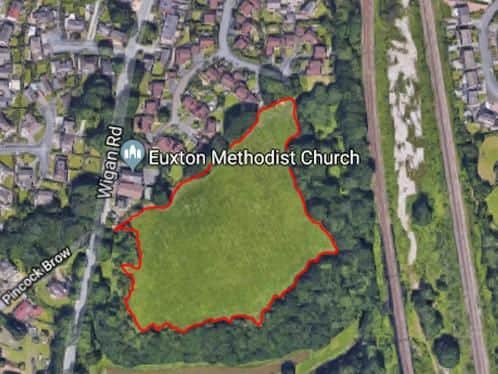 The homes are earmarked for the plot of land outlined in red