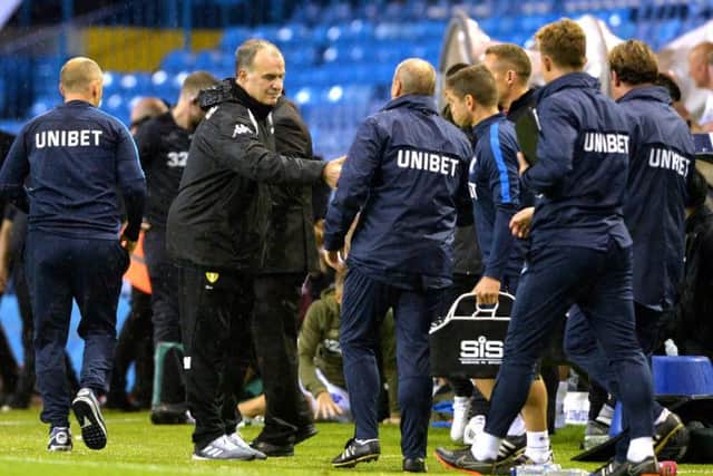 Marcelo Bielsa shaking hands with the PNE staff after the league game at Elland Road