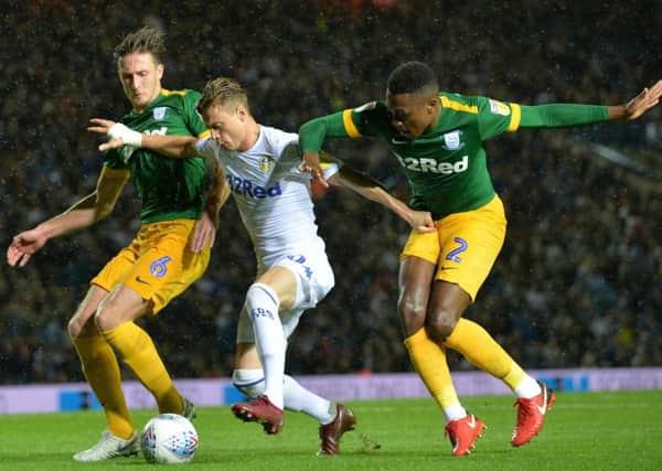 Leeds United's Ezgjan Alioski pushes past Preston Ben Davies and Darnel Fisher when the two sides met in the Championship earlier in the season