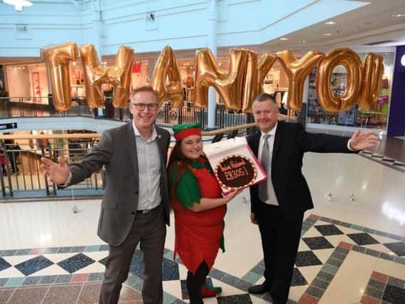 Stuart Clayton and Charlotte Carnell of Galloway's celebrating its Christmas grotto success at St George's shopping centre with manager Andrew Stringer