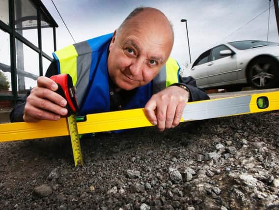 "Mr Pothole", Mark Morrell, visits Kennington to inspect the potholes. (Picture: ITN)