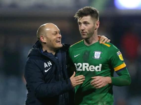 Alex Neil and Paul Gallagher celebrate at Loftus Road at the final whistle