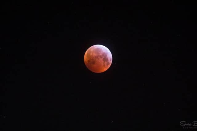 The moon glowing red during this morning's eclipse. Pic: Sonia Bashir