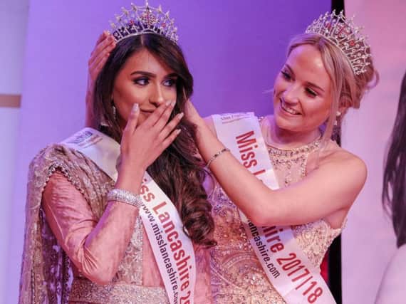 Aysha Khan is crowned by last year's Miss Lancashire Elle Finch