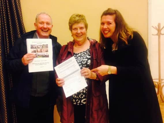 Parish Council councillors David Mills, coun Pat Hastings and coun Leila Eccles after villagers voted overwhelmingly to support the Neighbourhood Plan which allows them to have a say on housing developments.