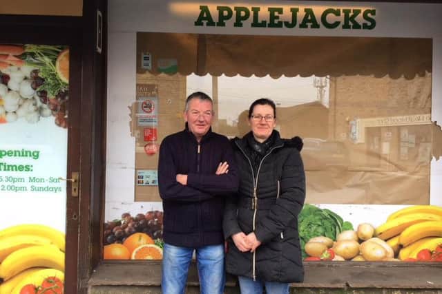 Tom and Gill - preparing to reopen their shop as a micro bar