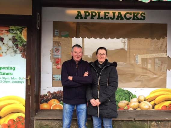 Tom and Gill - preparing to reopen their shop as a micro bar