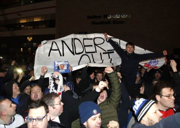 Bolton Wanderers fans protest before Monday night's game against West Bromwich Albion