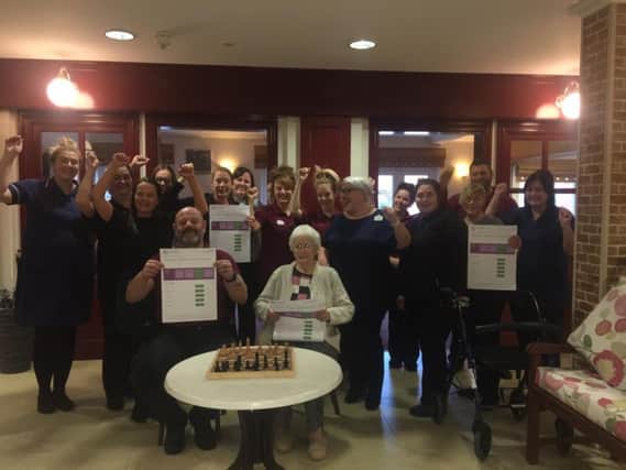 The Lodge staff and residents celebrate a good CQC report