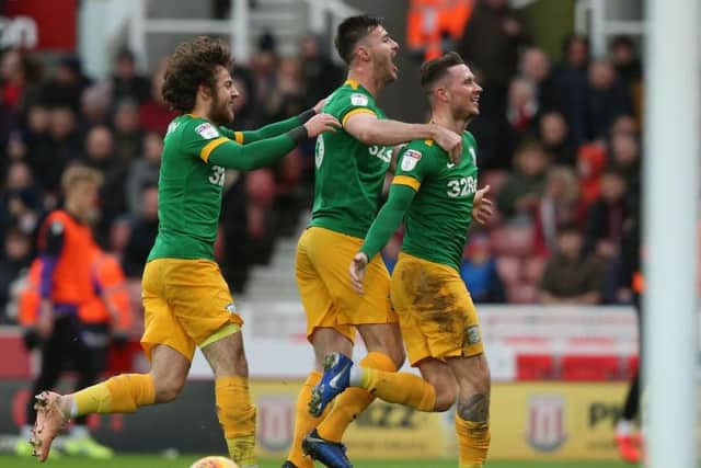 Alan Browne celebrates opening the scoring with Andrew Hughes and Ben Pearson