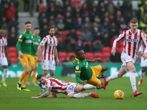 Darnell Fisher in the thick of the action against Stoke