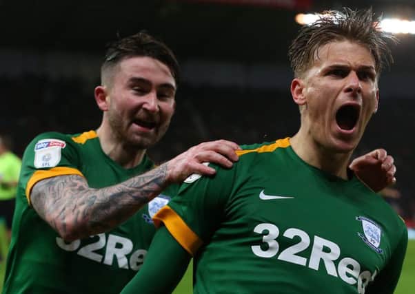 Preston North End's Brad Potts celebrates scoring his side's second goal against Stoke with sean Maguire (left)