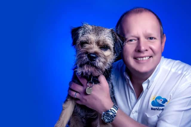 Kevin Matthews, owner of Barking Mad Pet Care Central Lancashire franchise, with his dog Derby