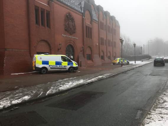 Police outside Wigan and Leigh Magistrates' Court this morning