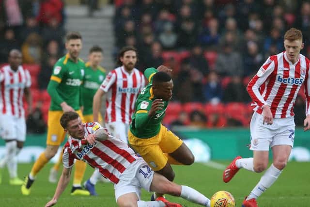 Darnell Fisher in the thick of the action last time out against Stoke