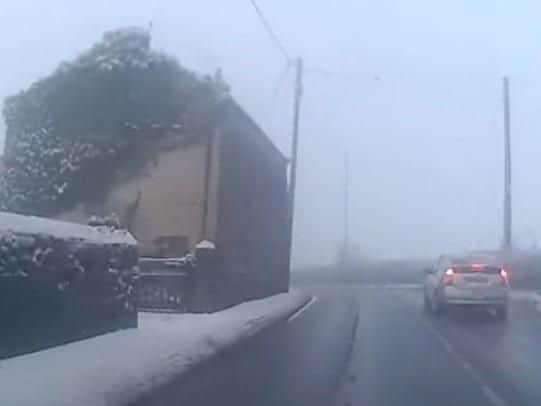 The taxi on the wrong side of the road approaching a bend