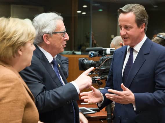 David Cameron (right) with Angela Merkel and Jean-Claude Juncker