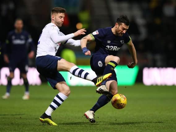 Paul Gallagher battles with PNE old boy David Nugent on Friday night. Picture: Getty Images