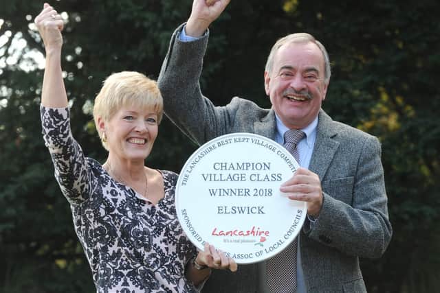 The Chairman of Elswick Parish Council Paul Hayhurst and Martine Hayhurst celebrate Elswick being named the county's Best Kept Village of the  Year 2018