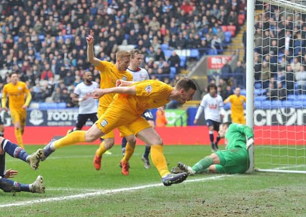 Marnick Vermijl's shot is touched home by Eoin Doyle for Preston's late winner against Bolton at the Macron Stadium in March 2016
