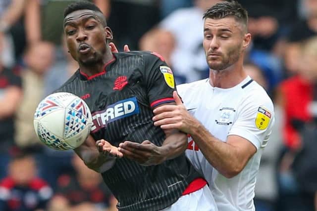 Sammy Ameobi and Andrew Hughes challenge for the ball in PNE's 2-2 draw with Bolton at Deepdale