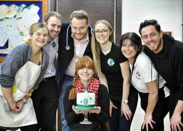 Lucy Gillhespy , centre, with the birthday cake, pictured with some of the supporters