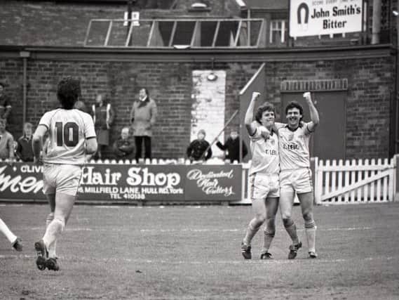Ian Stevens is congratulated by Peter Houghton after scoring for Preston against York City in 1985