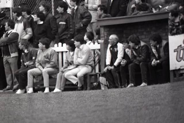PNE manager Tommy Booth (right) and assistant boss Brian Kidd watch from the bench
