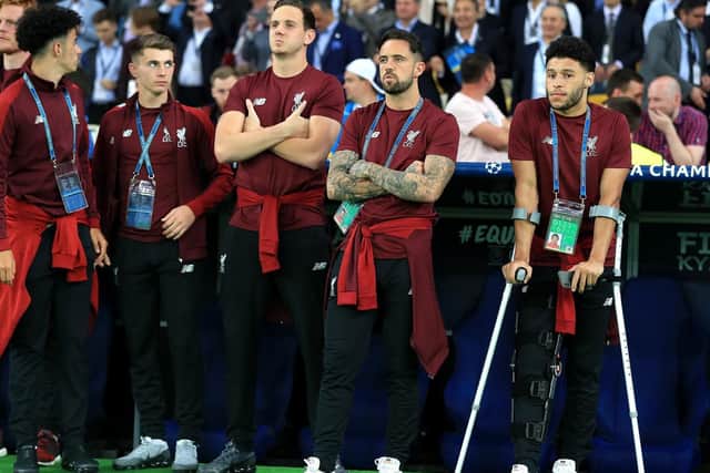 Liverpool's Alex Oxlade-Chamberlain (right) on crutches due to a knee injury during the UEFA Champions League Final at the NSK Olimpiyskiy Stadium