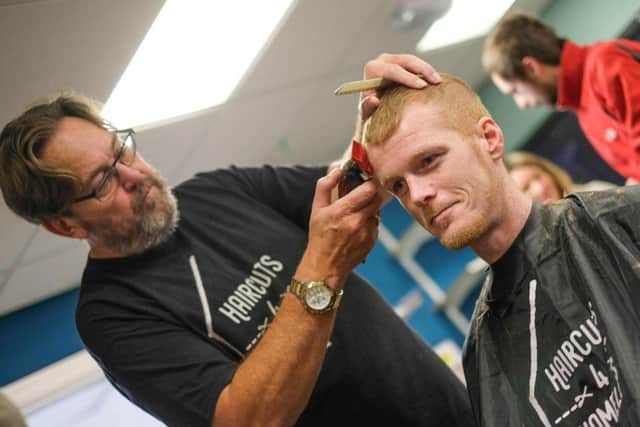 Stewart Roberts who is an ambassador from Haircuts4homeless donating his time to give free haircuts at Preston's Foxton Centre
