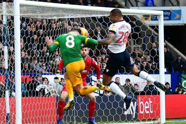 Alan Browne heads for goal against Bolton