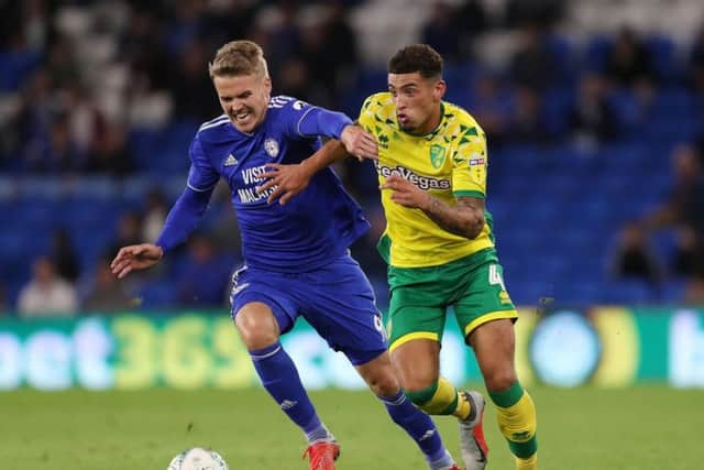 Norwich City's Ben Godfrey and Cardiff City's Danny Ward battle for the ball