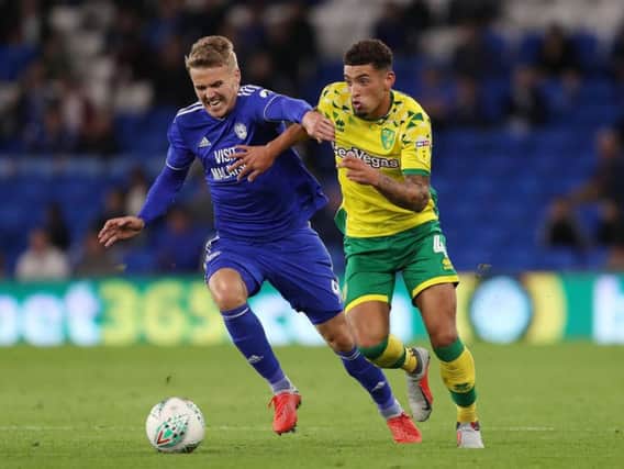 Norwich City's Ben Godfrey and Cardiff City's Danny Ward battle for the ball