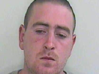 Stuart Taylor, 35, is wanted by police in connection with a robbery in Samuel Street, Preston on January 13.