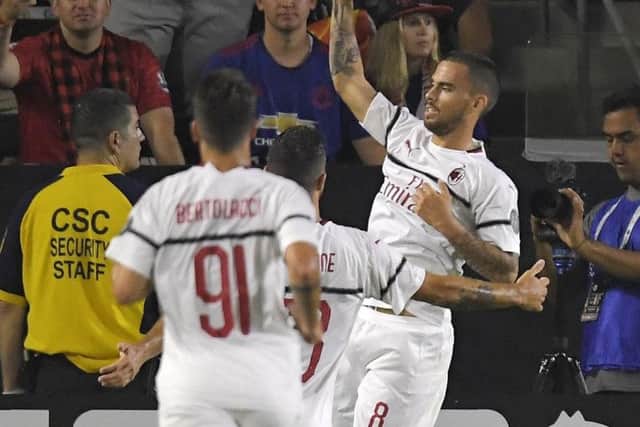 AC Milan forward Suso, right, celebrates his goal with teammates during the first half of an International Champions Cup tournament soccer match against the Manchester United.