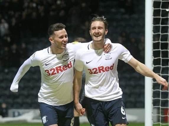 Ben Davies celebrates with Alan Browne after giving Preston an early lead against Norwich City at Deepdale