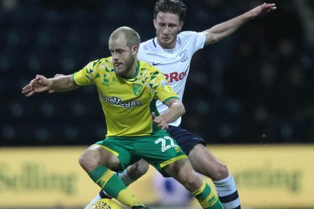 Preston defender Ben Davies challenges Norwich's Teemu Pukki