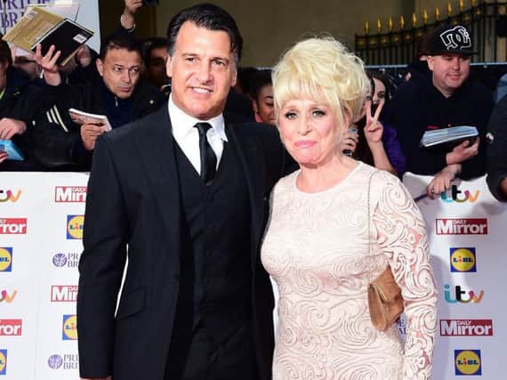 Dame Barbara Windsor and Scott Mitchell, as Mr Mitchell has urged people to check for the early signs of dementia in loved ones on Valentine's Day